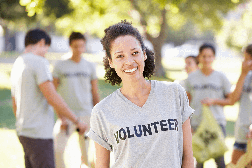 Women wearing a volunteer shirt 