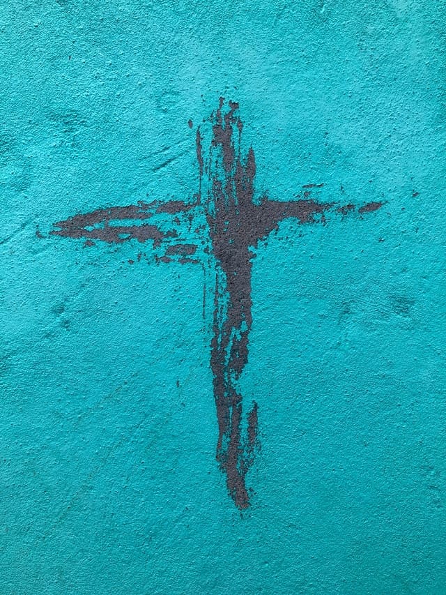 Black cross on blue background