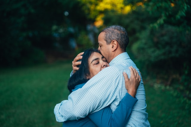 a guy and girl hugging